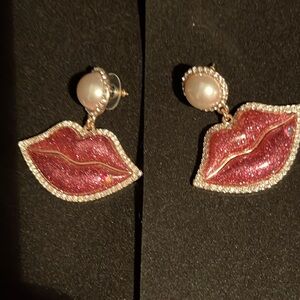 Betsy Johnson pink dangle lips and pearl earrings.